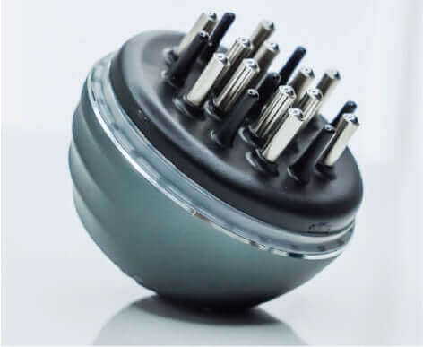 KÖ-HAIR Circulation Comb with metal prongs for effective scalp massage and tonic application.