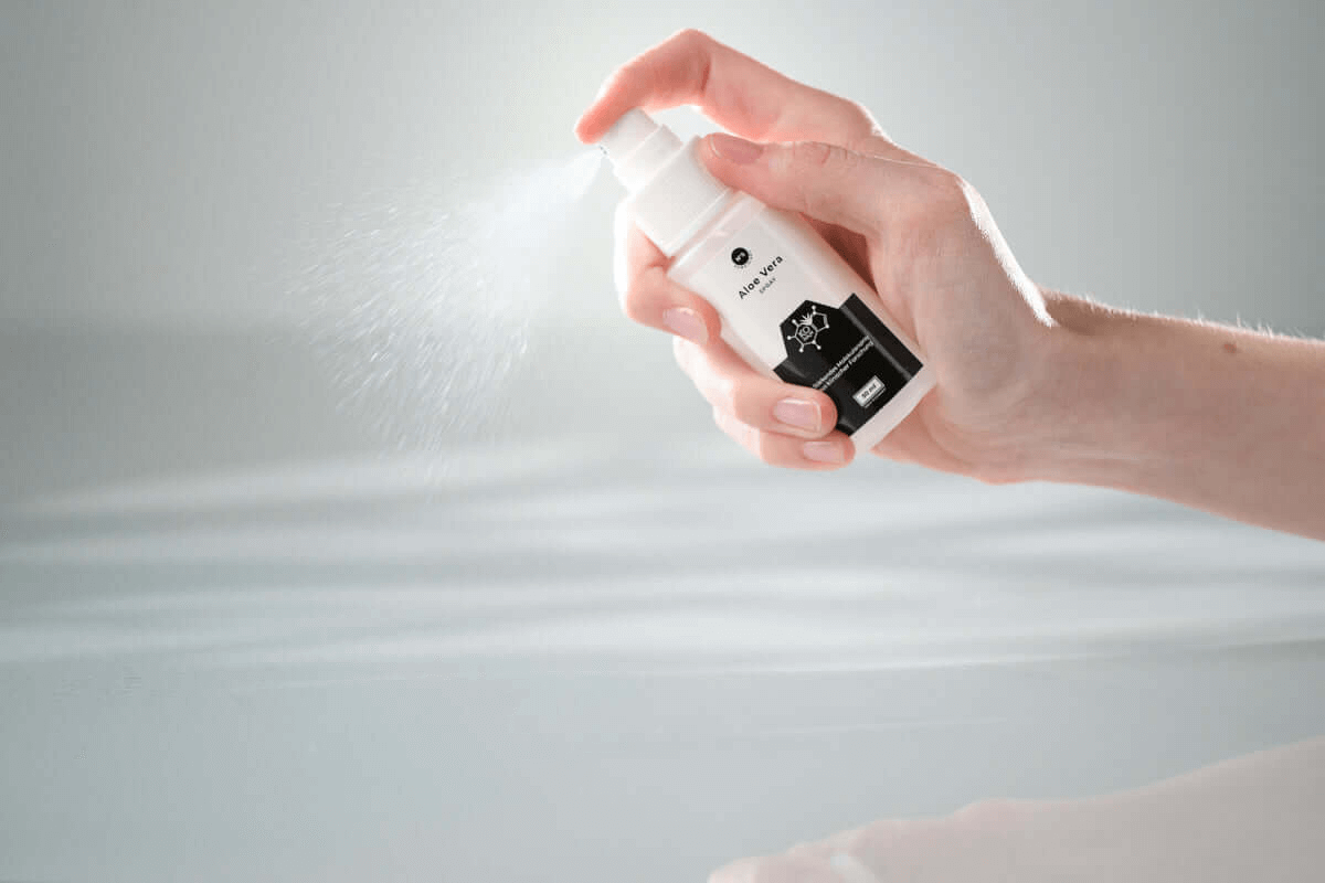 KÖ-HAIR Aloe Vera Spray being applied, providing soothing hydration for sensitive skin.