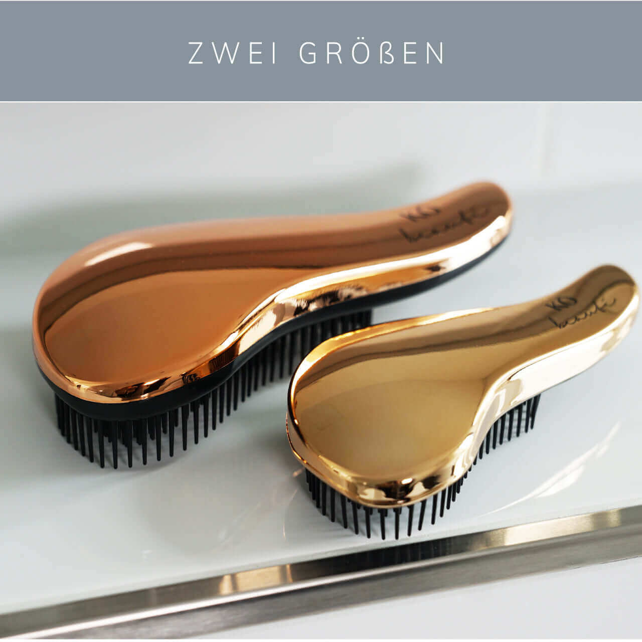 Zwei Größen der KÖ beauté Hair Brush Detangler Bürste in elegantem Design für schmerzfreies Entknoten von Haaren.