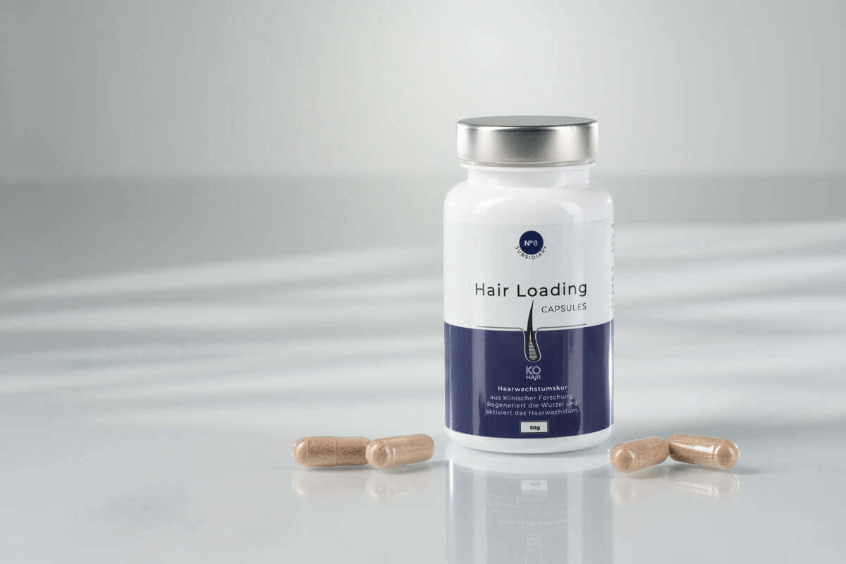 KÖ-HAIR Hair Loading Capsules bottle with capsules, promoting hair health using natural ingredients.